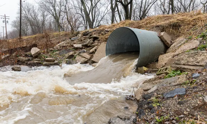 Environmental-Consulting-Firm-Houston-TX Stormwater coming out of a large pipe.