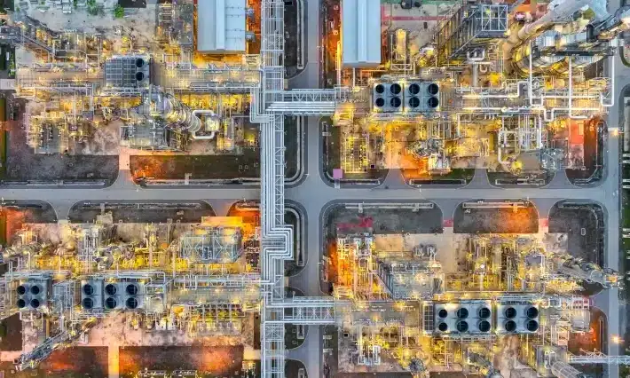 Aerial view of an oil and gas refinery at dusk
