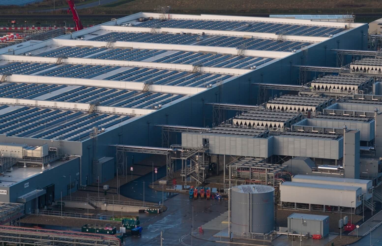 Aerial view of large data center campus with rooftop cooling systems